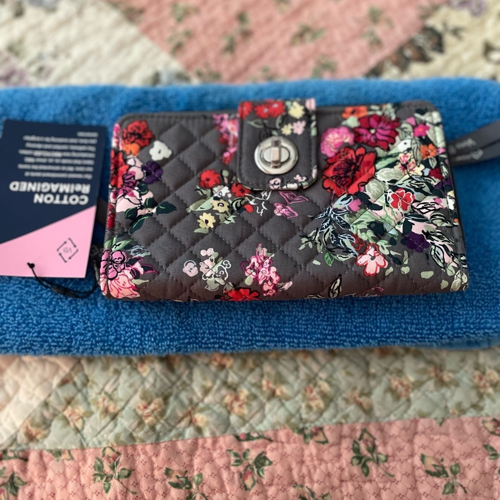 Brand new Vera Bradley wallet.  Beautiful floral pattern!  Never used .